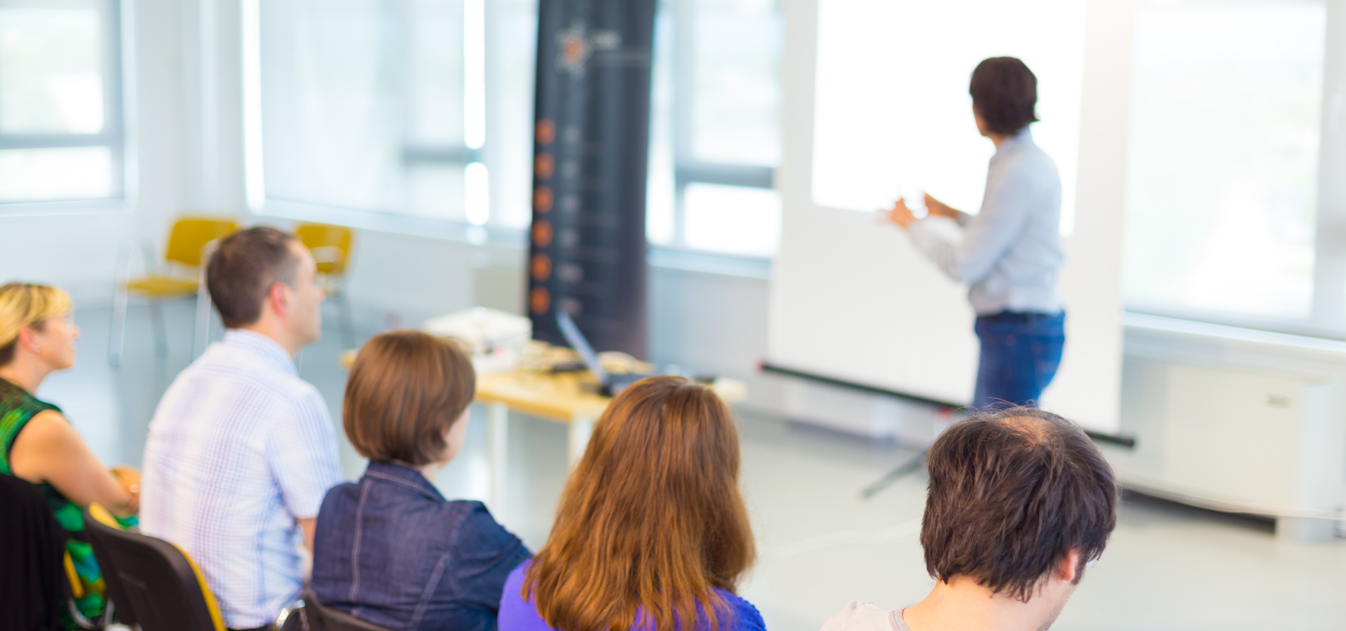 Adults learning at a workshop.