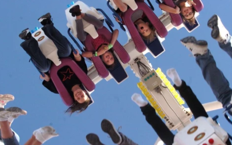 Young thrill seekers soak up upside-down fun on a midway ride at the annual Western Fair in London. (Free Press file photo)