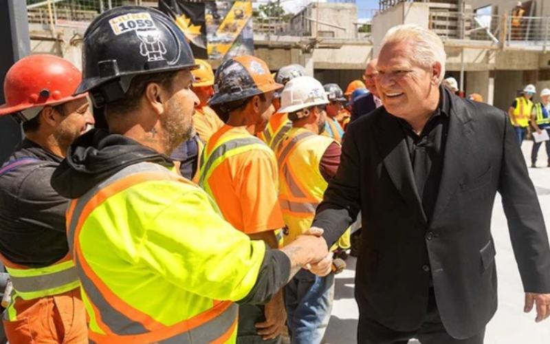 Premier Doug Ford shakes hands with LiUNA 1059 workers at the 11-storey Bluestone Construction’s residential tower being erected at 133 Pond Mills Road in London. Photo taken on Monday, Aug. 25, 2025. (Mike Hensen/The London Free Press)