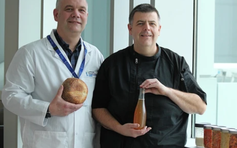 Jeremy Burton, left, who leads one of Canada’s largest microbiome research programs, and chef Connor Flynn, a master food preserver and high school teacher, showcase a variety of fermented foods Friday, Nov. 14, 2025, at St. Joseph’s Health Care London. (Dale Carruthers/The London Free Press)