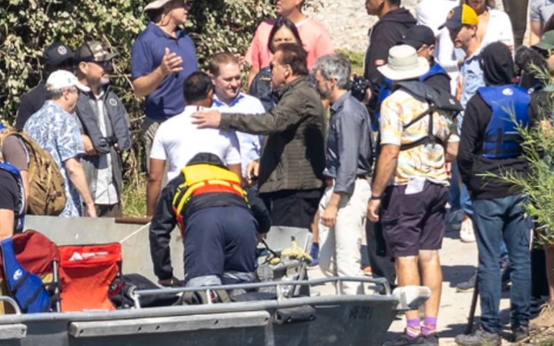 Arnold Schwarzenegger takes a break to meet Mayor Josh Morgan and Kapil Lakhotia of the London Economic Development Corp. at Fanshawe Conservation Area on August 7, 2024. Schwarzenegger was filming scenes for his Netflix show FUBAR on a boat in Fanshawe Lake. (Derek Ruttan/The London Free Press)