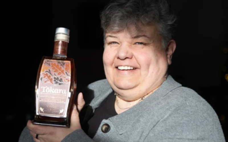 Paradigm Spirits co-owner Michelle Debus holds a bottle of 28-year-old Tökara whisky in London on Tuesday, Dec. 16, 2025. (Derek Ruttan/The London Free Press)