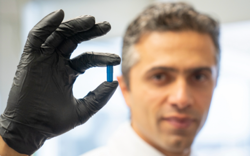 Saman Maleki, professor at Western's Schulich School of Medicine & Dentistry and scientist at London Health Sciences Centre Research Institute, holds up a so-called 'poop pill' used for fecal microbiota transplants. Western researchers and their collaborators have promising research showing their role in kidney, skin and lung cancer treatment. (London Health Sciences Centre)