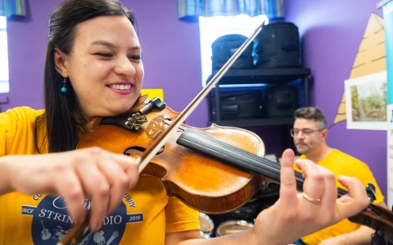 Celina Marie DiCecca, on fiddle, and her husband, Tony Nesbitt-Larking, on drums and guitar. DiCecca is the director of the Great Canadian Fiddle Show, which will be held at Aeolian Hall in London. Photograph taken Thursday, Jan. 29, 2026. (Mike Hensen/The London Free Press)