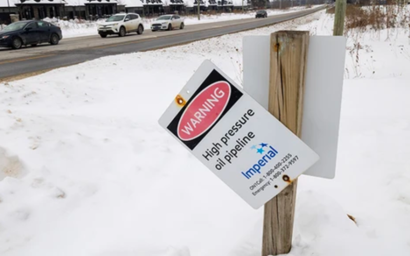 A warning sign marks an Imperial Oil pipeline running along the north side of Sunningdale in London. The pipeline is slated to be decommissioned to allow for the planned widening of the road. Photograph taken Monday, Feb. 2, 2026. (Mike Hensen/The London Free Press)