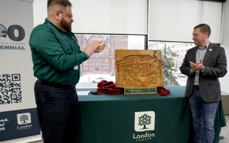 Above: Paul Yeoman, Director, Parks & Forestry (left) and Mayor Josh Morgan (right) unveil the commemorative Forest Capital of Canada plaque at London City Hall.
