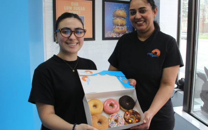 Fluffly Glaze Donut employees Savannah Da Silva and Jass Dhaliwal were photographed in the downtown shop at 515 Richmond St. on Sunday April 12, 2026. (Beatriz Baleeiro/The London Free Press)