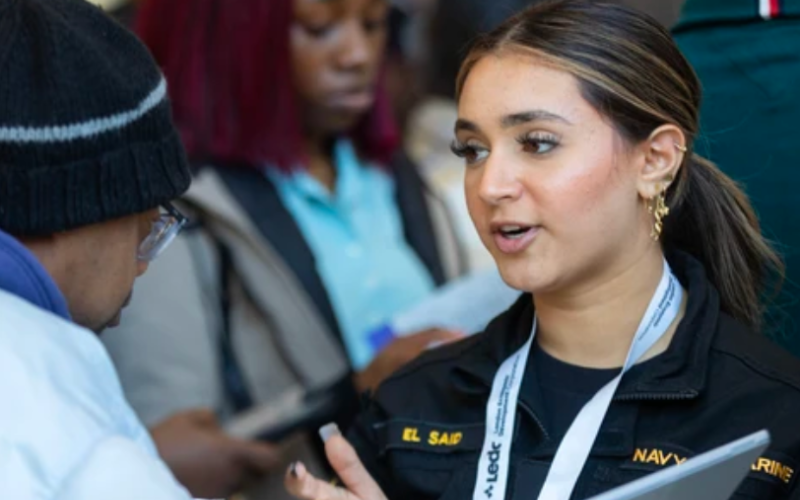 Sireen El Said, a marine technician at HMCS Prevost in London, talks with a job fair participant at White Oaks Mall on Tuesday, April 21, 2026. El Said said her mechanical skills are transferable after leaving the armed forces, and she has seen growing public interest in the Canadian Armed Forces and its training and career opportunities. (Mike Hensen/The London Free Press)