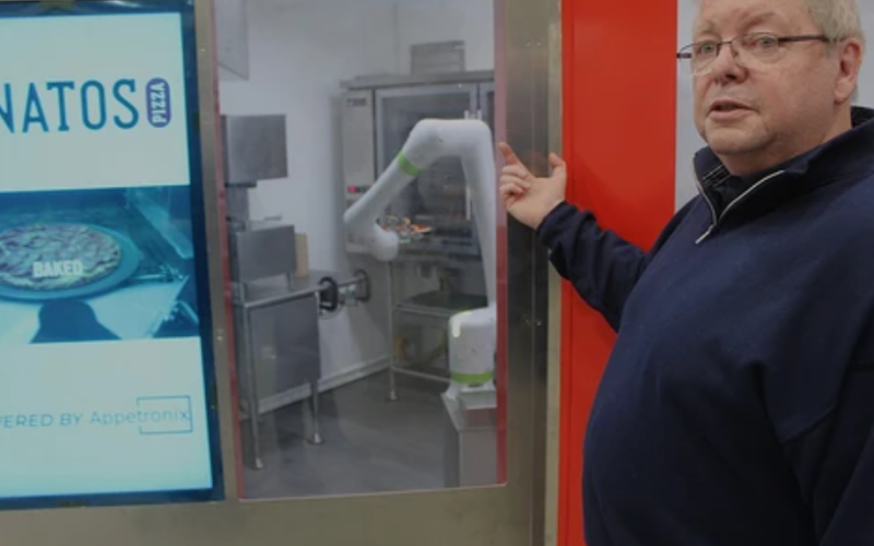 Appetronix chief administrative office Ray Schott shows a robot pizza maker, shown here placing a pizza into an oven, on Wednesday, April 29, 2026, in London. (Dale Carruthers/The London Free Press)