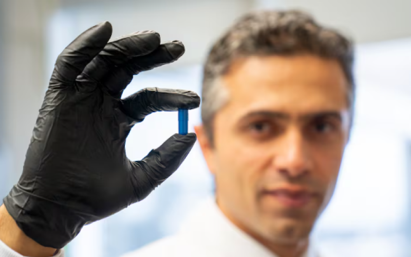 Dr. Saman Maleki, a scientist at London Health Sciences Centre Research Institute in London, Ont., holds up a "poop pill." (Source: LHSC)