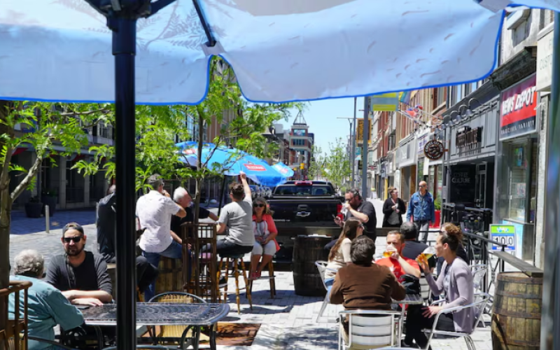 Customers enjoying the patio outside of The Scot's Corner in downtown London, Ont., as patios across Ontario reopen. (Colin Butler/CBC News)