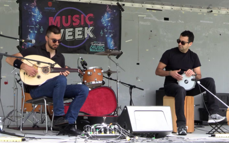 Anthony Saoud (left) and Dorukhan Turan of Falefal Funk perform on stage at The Gathering on the Green in Wortley Village on June 6, 2026 as part of Forest City London Music Week. (Brent Lale/CTV London)