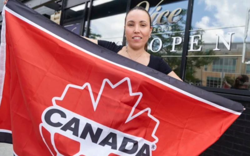Diana Gutierrez, owner of Vice Supper Club, poses with a Soccer Canada flag outside her restaurant in London on Wednesday, June 10, 2026. Gutierrez is preparing to host World Cup watch parties during the tournament. (Geoff Robins/The London Free Press)