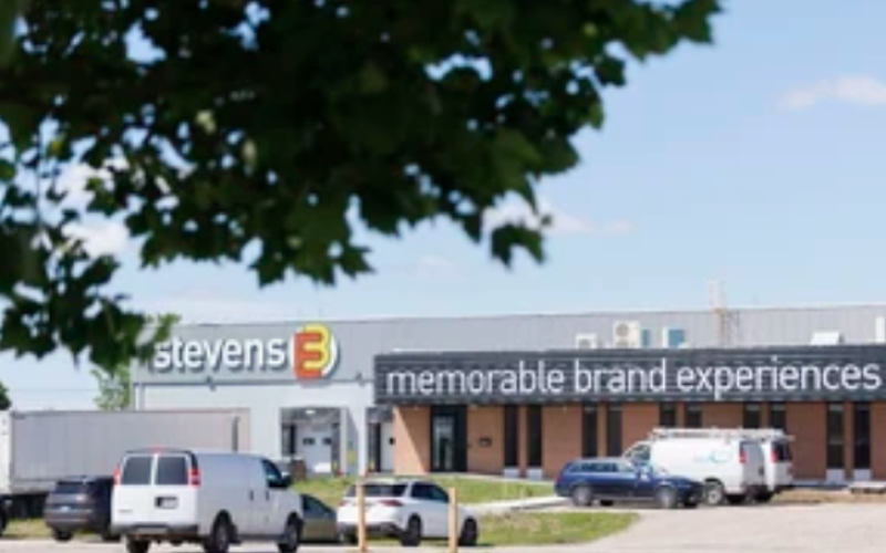 The signs for exhibit fabricator Stevens E3: Memorable Brand Experiences hang from the former Accuride plant in London on Tuesday, June 23, 2026. (Geoff Robins/The London Free Press)