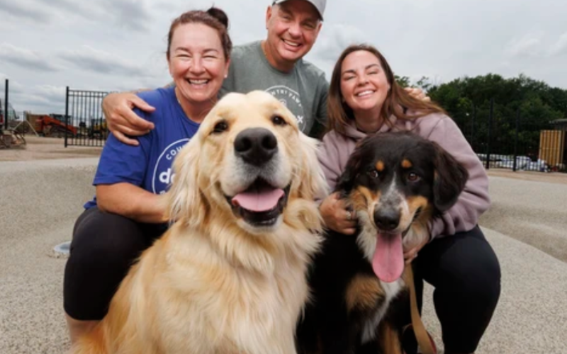 (L-R) Michelle, Jaymie and Skylar Crook, owners of Country Paws, pose for a photo with their dogs Doug (left) and Dilly at their new facility on Bradley Avenue in London on Friday, June 26, 2026. (Geoff Robins/The London Free Press)
