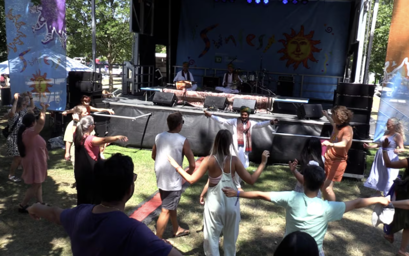 Zakir Khan of Rajasthani folk music trio SAZ dances in front of the Sunfest stage