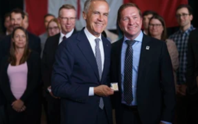 Prime Minister Mark Carney poses with London Mayor Josh Morgan following a news conference at General Dynamics Land Systems-Canada in London on Thursday, July 16, 2026. (Geoff Robins/The London Free Press)