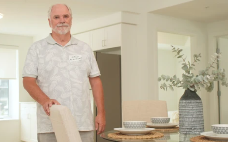 Greg Playford, a member of the London Community Foundation's housing action committee, stands inside a model apartment suite during the Village SoHo open house in London on Saturday, July 18, 2026. (Matthew Daldalian/The London Free Press)