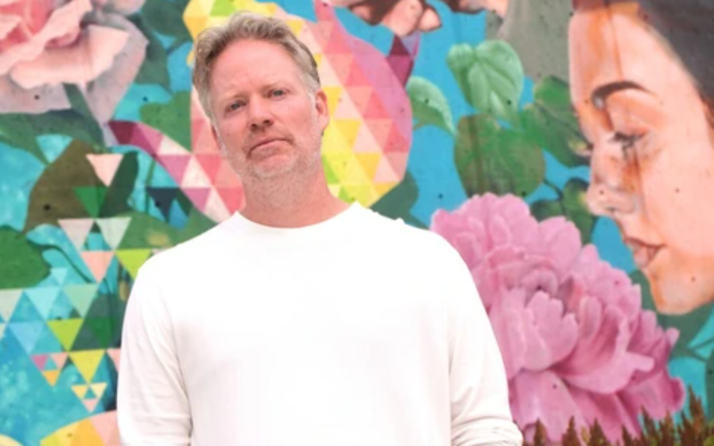 Andrew Gunn stands in front of a mural behind the St. Thomas Public Library on Thursday, July 16, 2026. (Matthew Daldalian/The London Free Press)