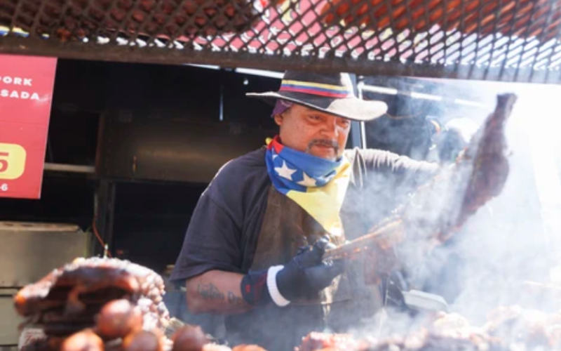 Jorge Gonzalez of Go Gonzales BBQ prepares ribs during Ribfest at Victoria Park in London on Thursday, July 30, 2026. (Geoff Robins/The London Free Press)