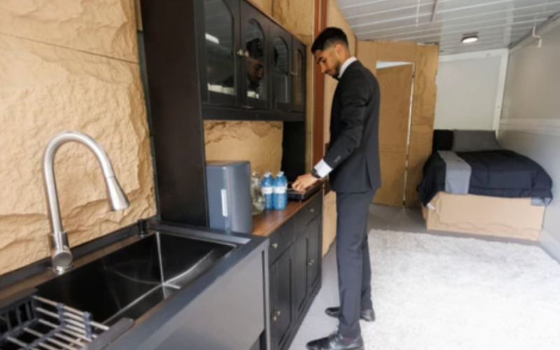 Western University engineering student Ribal Zebian checks out the cooktop in one of his modular homes in London on Friday, June 19, 2026. He plans to live inside it for the next year to test out his design. Geoff Robins/The London Free Press