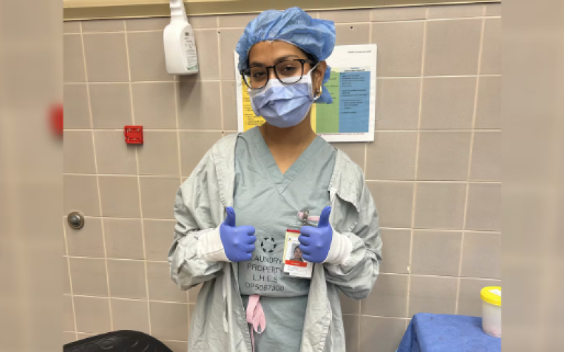 Anviksha Singh in scrubs during summer high school internship at LHSC. (Source: Submitted)