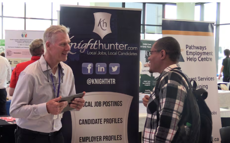 Abdaallah Siidi (right) came to London from Morocco just ten days ago. He was speaking with Mike Sherlock, president of Knighthunter.com during Newcomer Day on Oct 10, 2026 (Source: Brent Lale/CTV London)