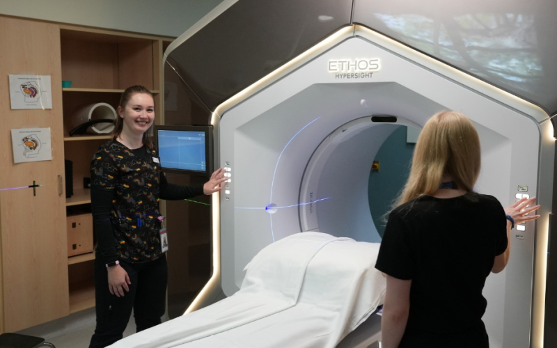 Photo from left: Meghan Koczwara and Christine Rossi, radiation therapists in the Verspeeten Family Cancer Centre preparing the Ethos linear accelerator (used to deliver radiation therapy) for a patient. 